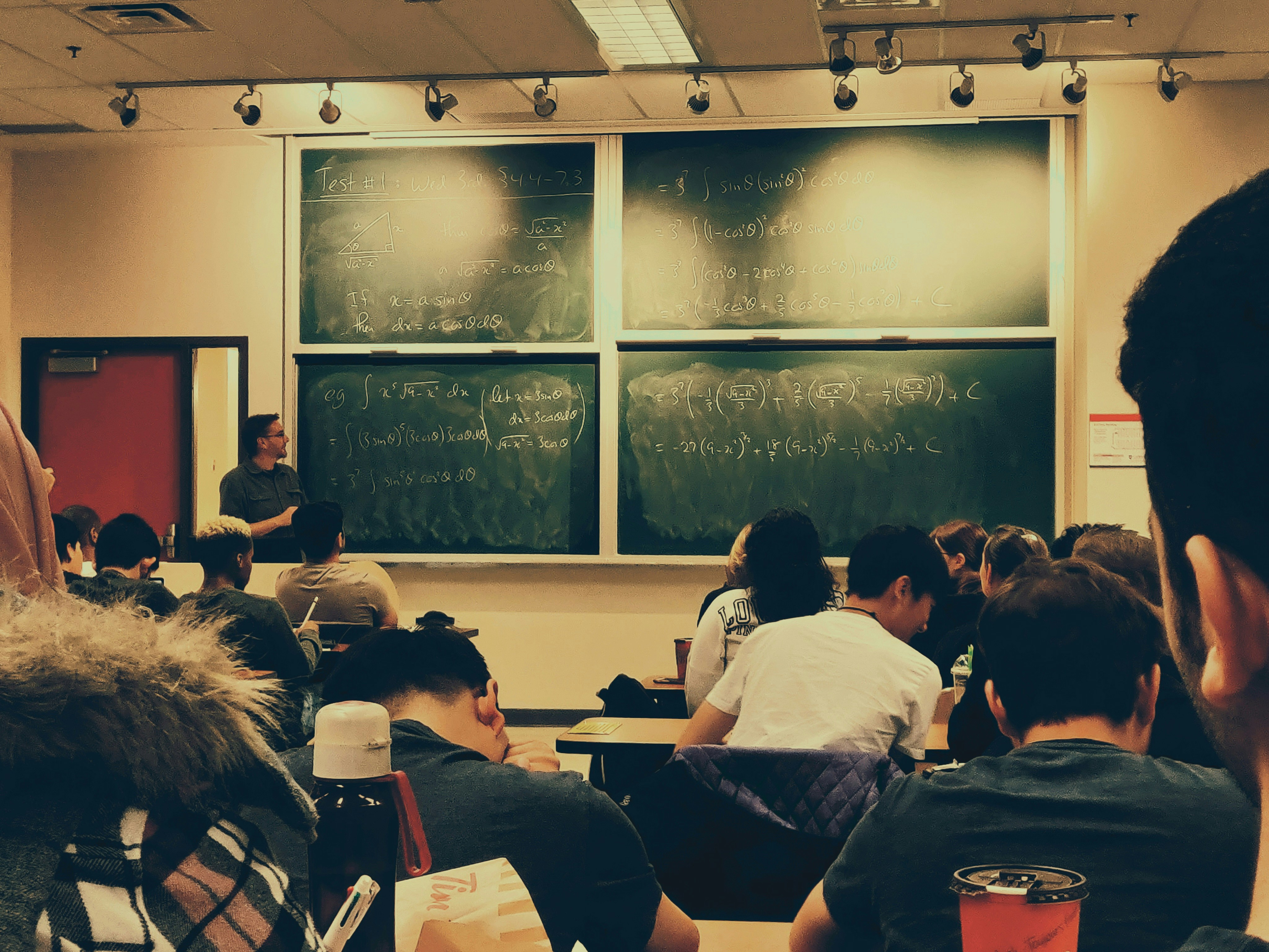 College students learning together in a classroom